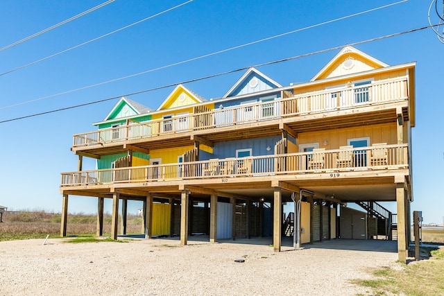 back of property with a balcony