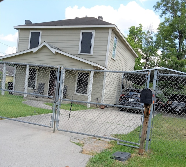 back of house with a lawn