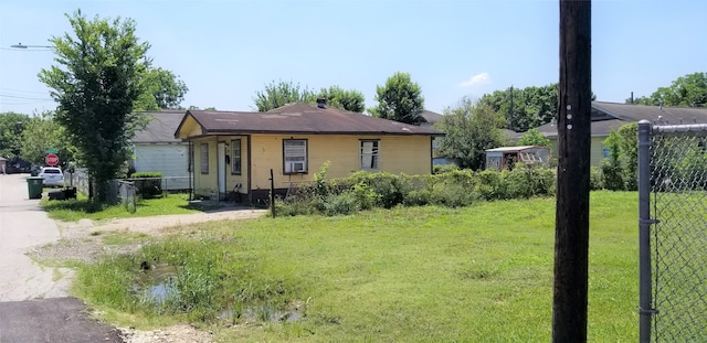 ranch-style house with a front lawn