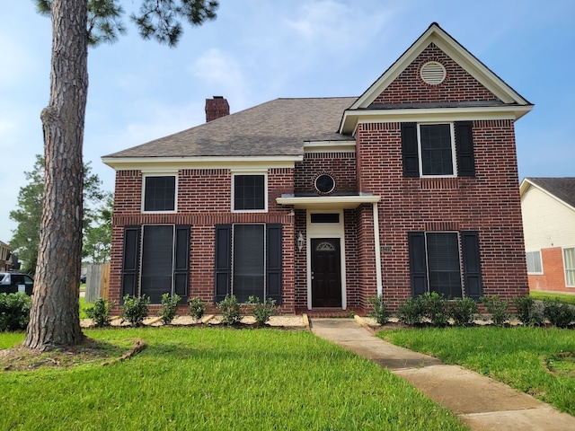 front facade featuring a front lawn