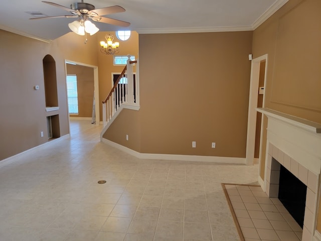 unfurnished living room with a tile fireplace, ceiling fan with notable chandelier, light tile floors, and crown molding