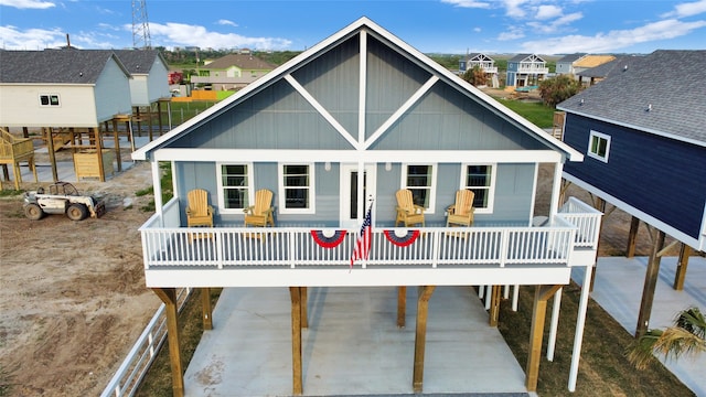 rear view of property featuring a deck