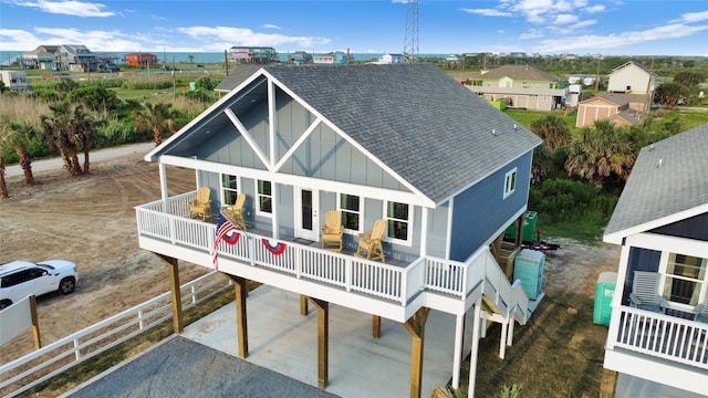 rear view of house featuring a balcony