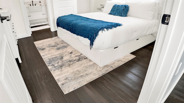 bedroom featuring dark hardwood / wood-style floors