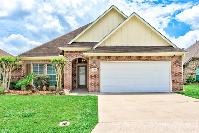 view of front of home featuring a front yard and a garage