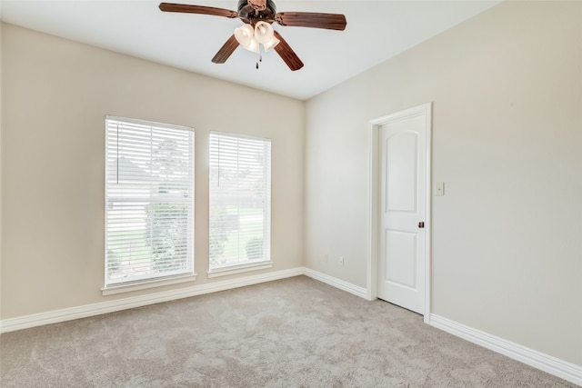 carpeted empty room with ceiling fan