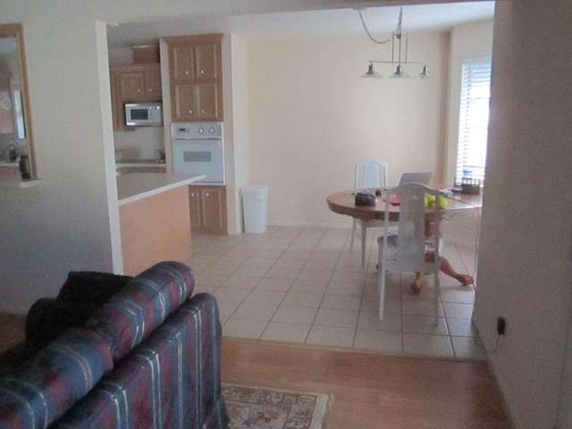 dining area with light tile patterned floors