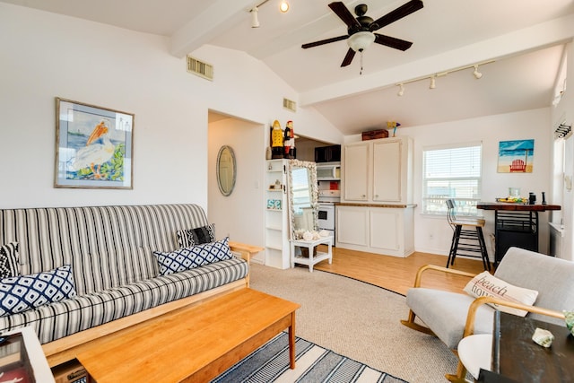 carpeted living room with ceiling fan and vaulted ceiling with beams