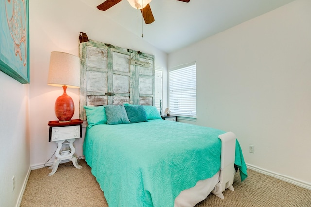 carpeted bedroom featuring lofted ceiling and ceiling fan