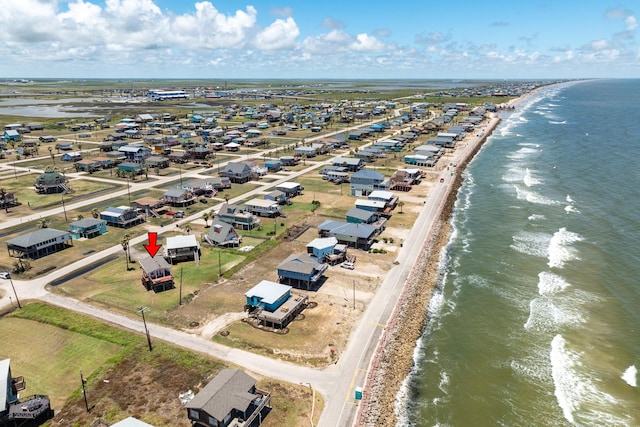 aerial view featuring a water view and a view of the beach