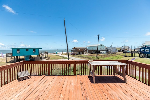 wooden deck with a water view