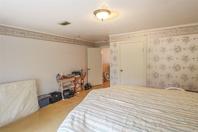 bedroom with crown molding