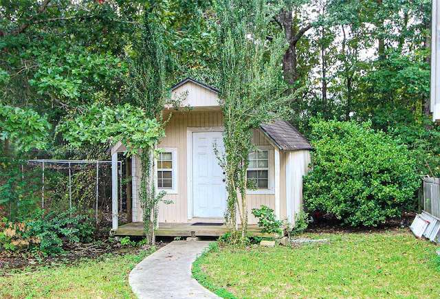 view of outdoor structure featuring a lawn