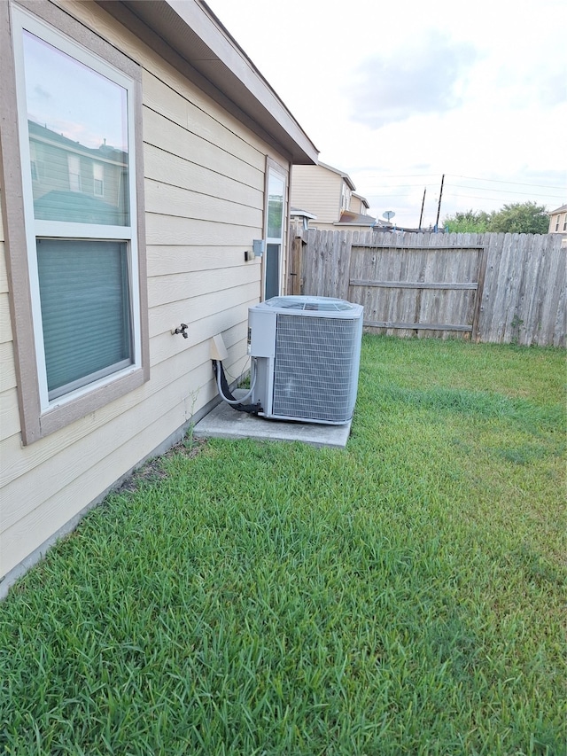 view of yard with central air condition unit