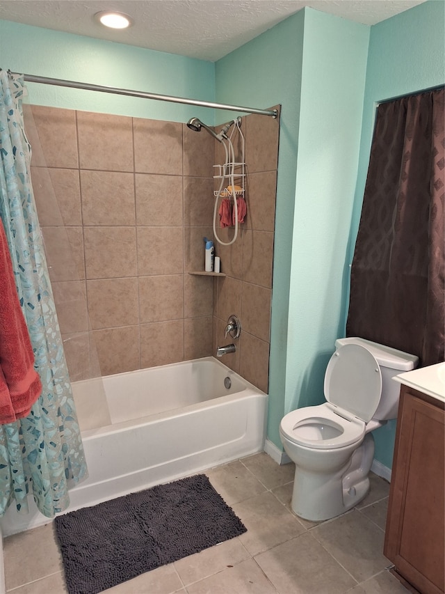 full bathroom featuring toilet, shower / bath combination with curtain, tile flooring, a textured ceiling, and vanity