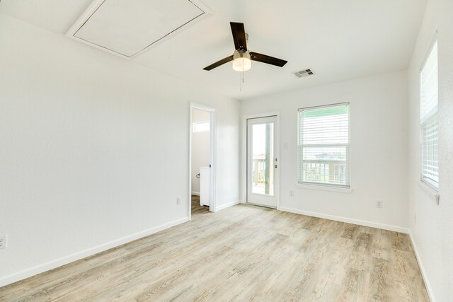 spare room with ceiling fan and light hardwood / wood-style flooring