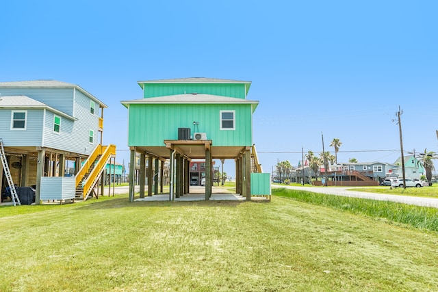 back of house featuring a yard