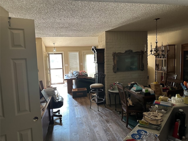 living room featuring hardwood / wood-style floors and a textured ceiling