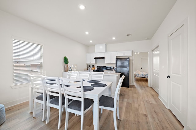 dining room with light wood-type flooring