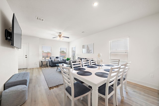 dining room featuring plenty of natural light, light hardwood / wood-style floors, and ceiling fan