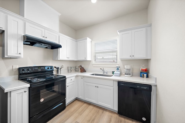 kitchen featuring white cabinetry, light hardwood / wood-style floors, black appliances, and sink