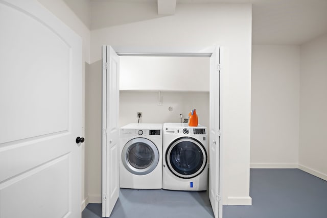 washroom featuring washing machine and dryer