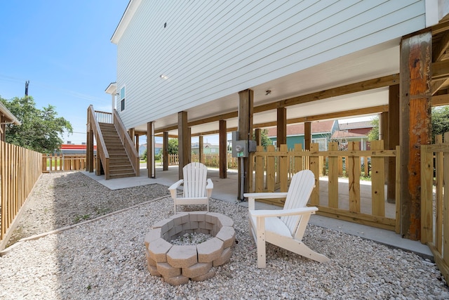 view of terrace featuring an outdoor fire pit