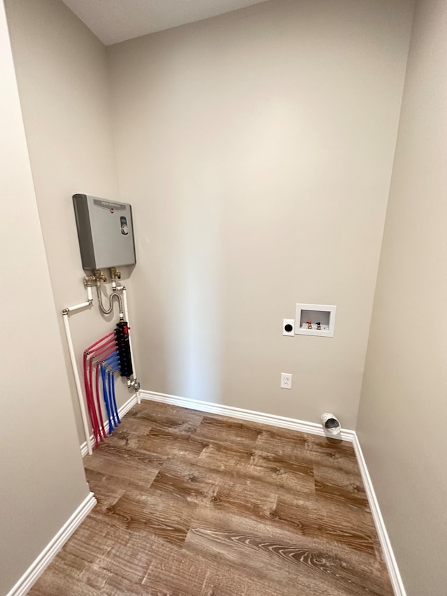 washroom featuring electric dryer hookup, hardwood / wood-style floors, and washer hookup