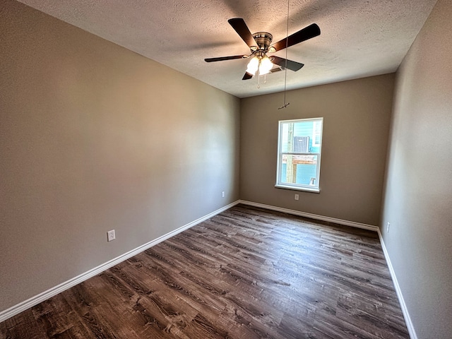 unfurnished room with ceiling fan, dark hardwood / wood-style floors, and a textured ceiling