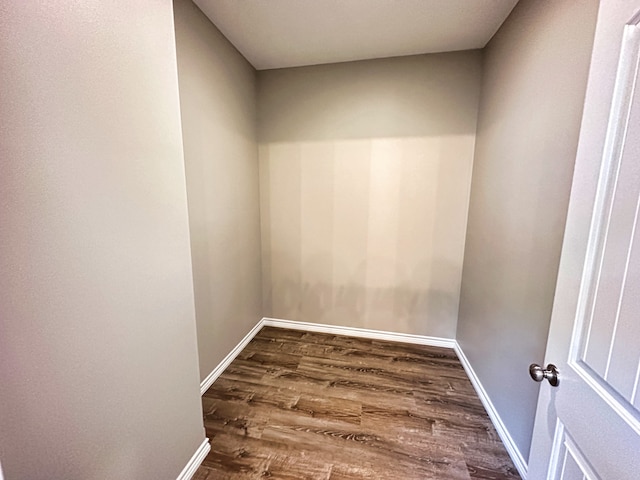 unfurnished room featuring dark hardwood / wood-style flooring