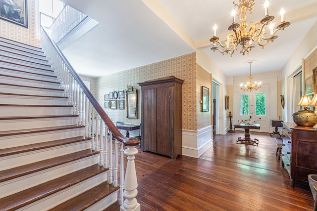 entrance foyer with a chandelier, french doors, and dark hardwood / wood-style floors