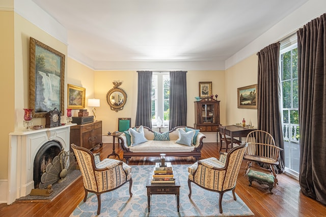 living area featuring a healthy amount of sunlight and light hardwood / wood-style flooring