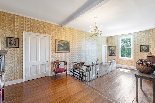 bedroom featuring beam ceiling, crown molding, dark hardwood / wood-style flooring, and a notable chandelier