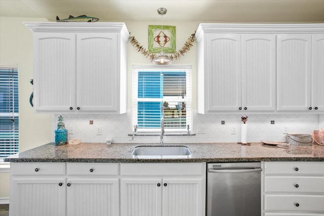 kitchen with tasteful backsplash, white cabinets, and dishwasher