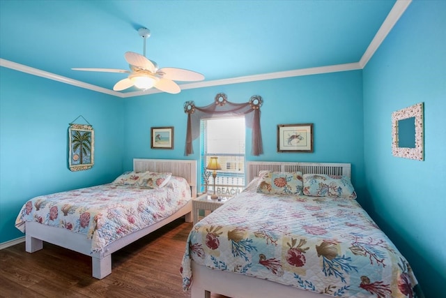 bedroom featuring ornamental molding, dark hardwood / wood-style flooring, and ceiling fan