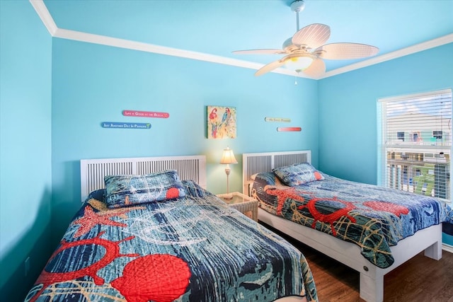 bedroom with ceiling fan, dark wood-type flooring, and ornamental molding