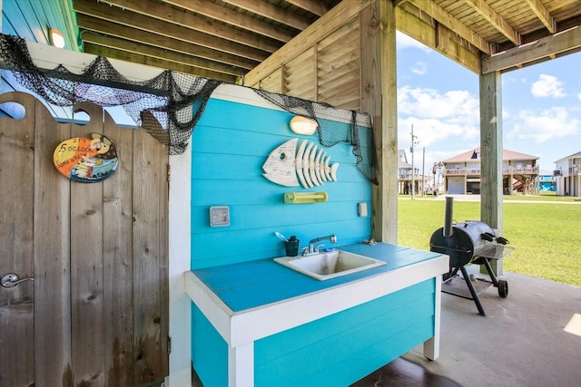 view of patio / terrace featuring grilling area and sink