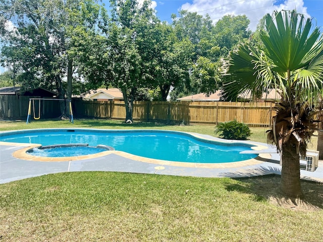 view of pool featuring an in ground hot tub, a diving board, and a lawn