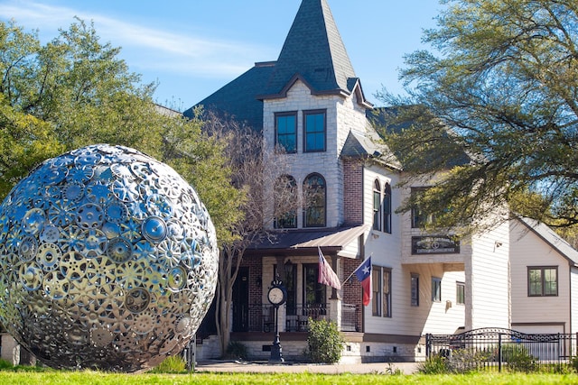 420 Heights Blvd, Houston, TX 77007 - view of front facade with covered porch and brick siding