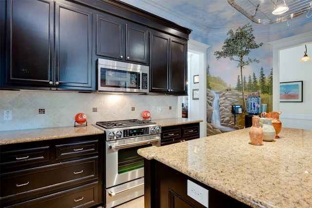 kitchen with decorative light fixtures, appliances with stainless steel finishes, light stone counters, tasteful backsplash, and crown molding