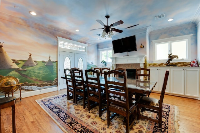 420 Heights Blvd, Houston, TX 77007 - dining room featuring a ceiling fan, light wood finished floors, a fireplace, crown molding, and recessed lighting