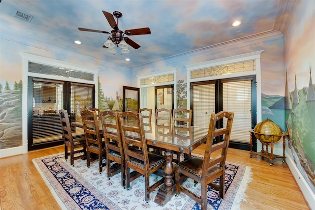 dining area with ornamental molding, light hardwood / wood-style floors, ceiling fan, and french doors