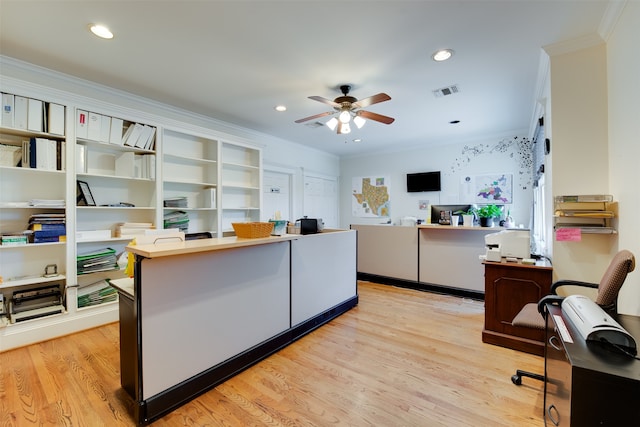 office featuring light hardwood / wood-style floors, ceiling fan, and ornamental molding