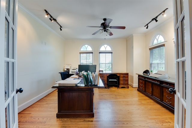 office area with rail lighting, light hardwood / wood-style floors, a healthy amount of sunlight, and ceiling fan