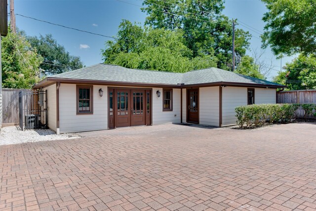 420 Heights Blvd, Houston, TX 77007 - ranch-style house featuring a shingled roof and french doors