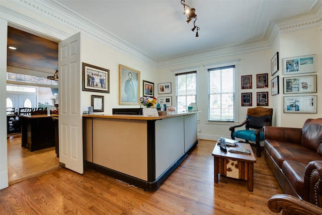 interior space featuring track lighting, french doors, and crown molding