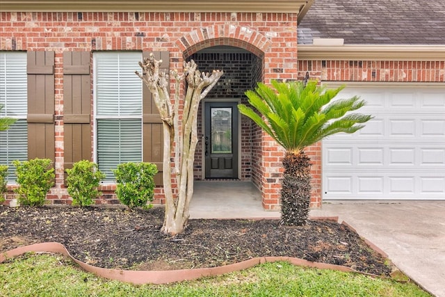 doorway to property featuring a garage