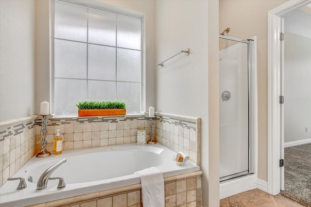 bathroom with tile floors and plus walk in shower