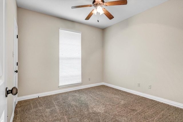 carpeted empty room featuring ceiling fan