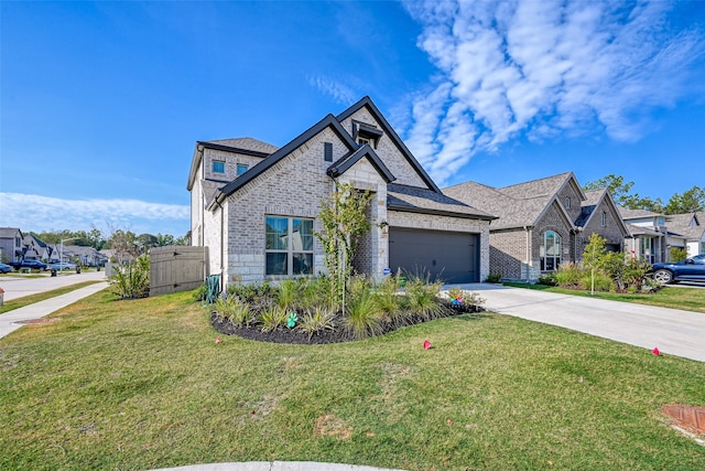 view of front facade with a front yard and a garage